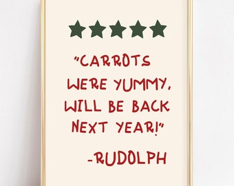 Puede incluir: Una impresión enmarcada blanca con una reseña de texto rojo y verde que dice "CARROTS WERE YUMMY. WILL BE BACK NEXT YEAR!" - RUDOLPH. Cinco estrellas verdes están por encima del texto.