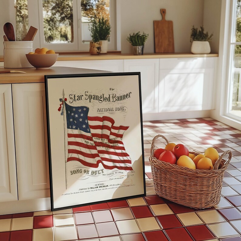 A vintage american flag printable wall art print of the star spangled banner song cover. This print features an american flag blowing in the wind. A patriotic red white and blue print to honor the usa for the 4th of july / independence day. This print is offered as a digital download printable wall art.