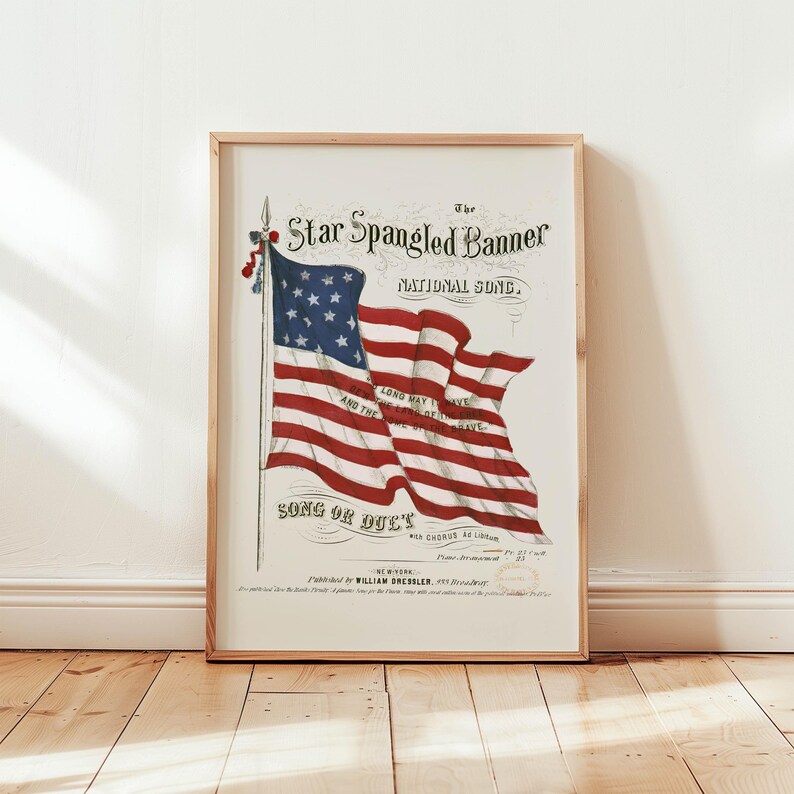 A vintage american flag printable wall art print of the star spangled banner song cover. This print features an american flag blowing in the wind. A patriotic red white and blue print to honor the usa for the 4th of july / independence day. This print is offered as a digital download printable wall art.