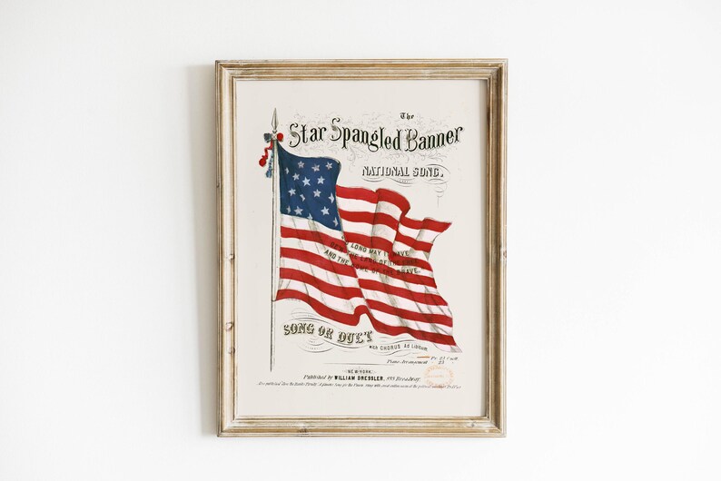 A vintage american flag printable wall art print of the star spangled banner song cover. This print features an american flag blowing in the wind. A patriotic red white and blue print to honor the usa for the 4th of july / independence day. This print is offered as a digital download printable wall art.