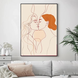 May include: Line art illustration of two people kissing. The artwork is in shades of orange, brown, and beige on a cream background.