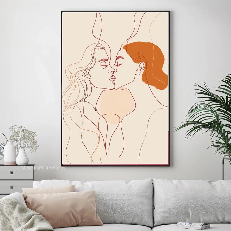May include: Line art illustration of two people kissing. The artwork is in shades of orange, brown, and beige on a cream background.