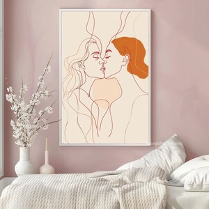 May include: Line art print of two people kissing. The artwork is in shades of orange and brown on a cream background.