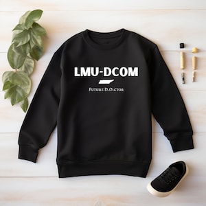 May include: Black sweatshirt with white text that reads "LMU-DCOM Future D.O.O.C.T.O.R" and an outline of the state of Tennessee.