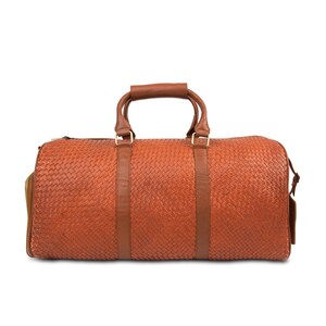 May include: A brown leather woven duffel bag with two top handles and a zipper closure.