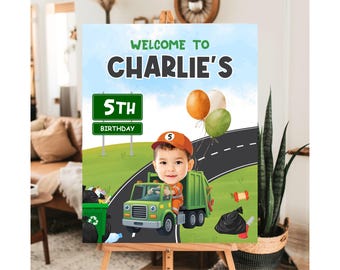 May include: A personalized birthday sign featuring a cartoon illustration of a child as a sanitation worker driving a green garbage truck. The sign reads "Welcome to Charlie's 5th Birthday" with balloons and a road design.