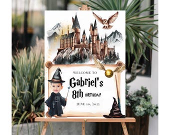 May include: A watercolor-style birthday sign featuring a castle, owl, and golden snitch. The sign reads "Welcome to Gabriel's 8th Birthday, June 10, 2025." A young boy in a wizard costume is also depicted. The sign is displayed on a wooden easel.