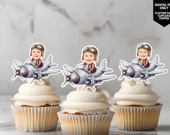 May include: Three cupcake toppers featuring a cartoon illustration of a child dressed as a pilot in a plane. The toppers are printed on white cardstock and are ready to be added to cupcakes.
