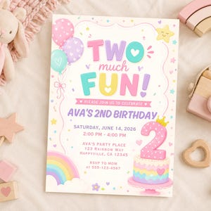 May include: A pastel-colored birthday invitation with the text "TWO much FUN!" and details for Ava's 2nd birthday. The design includes balloons, a rainbow, a cake, and star accents. A pink toy camera and wooden toys are also visible.