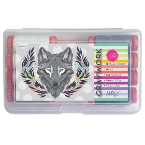May include: A clear plastic case containing ten small spools of Aurifil Graywork thread. The case features a decorative card with a wolf illustration and the text "GRAYWORK". Each spool contains 220 yards of 100% cotton thread.