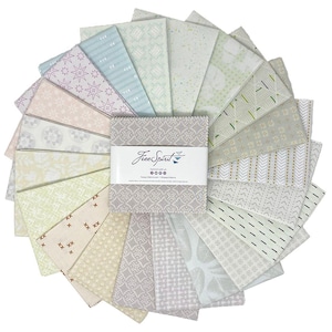 May include: A collection of fabric squares in various pastel colors, arranged in a circular pattern. The fabrics feature diverse patterns, including geometric shapes and floral designs. A central bundle is wrapped with a label that reads "FreeSpirit".