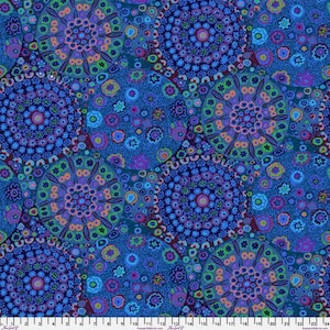 May include: A fabric with a repeating pattern of circular mandala-like designs in shades of blue, purple, green, and orange. The design features intricate floral and geometric elements, creating a vibrant and detailed textile.