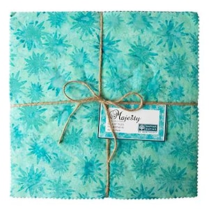 May include: A bundle of turquoise fabric squares tied with twine. The fabric features a repeating floral pattern in shades of blue and green. A tag reading "Majesty" is attached. The bundle measures approximately 10 inches by 10 inches.