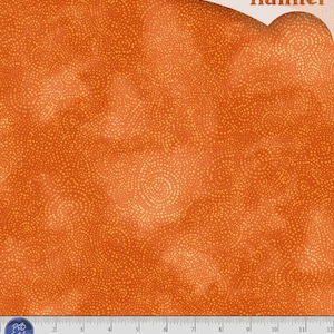 May include: Orange flannel fabric featuring a repeating pattern of small, light-colored dots arranged in swirling circular motifs. The fabric includes the text "flannel" at the top and a ruler at the bottom with markings in inches.