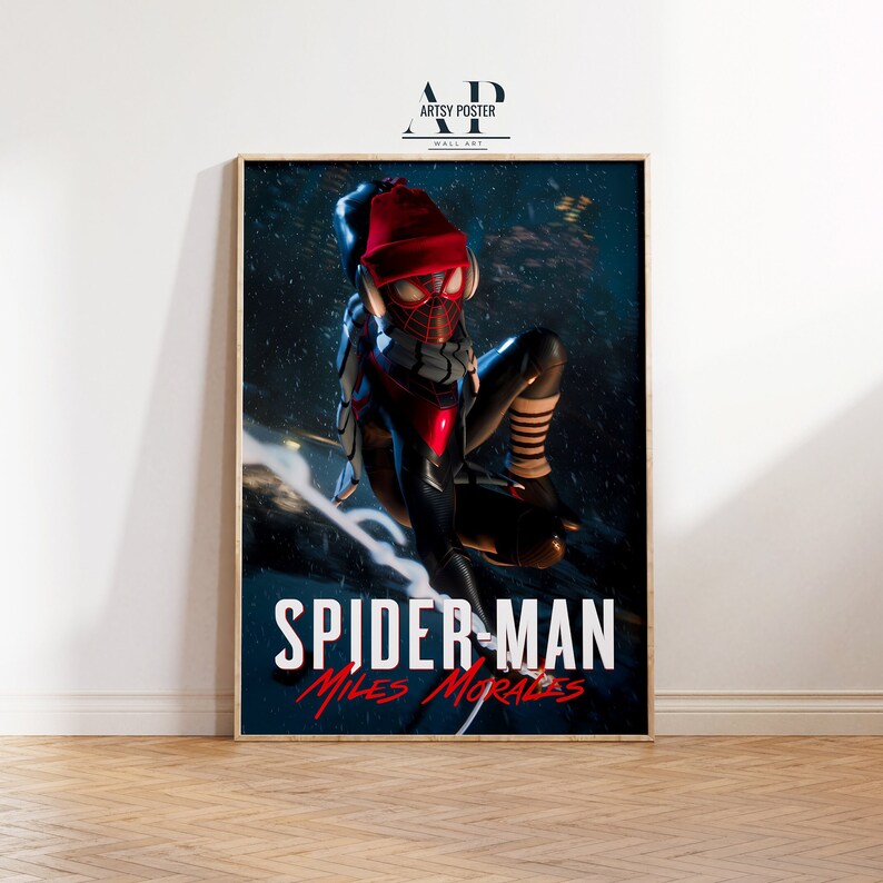 May include: A poster featuring a stylized illustration of Spider-Man, Miles Morales, in a red and black suit with a red beanie. The background is a dark blue with white snow falling. The text "Spider-Man Miles Morales" is at the bottom of the poster.