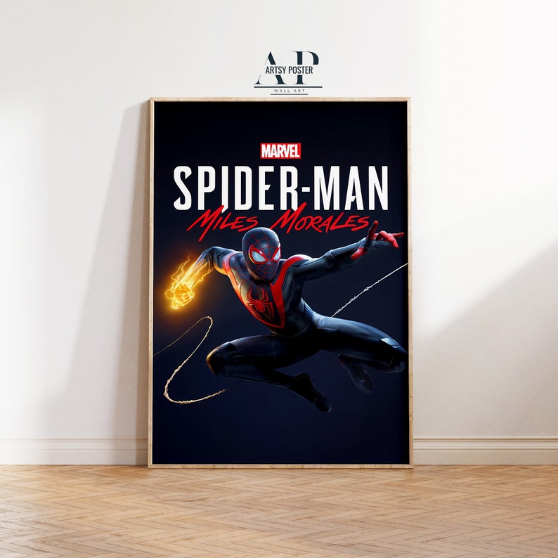 May include: A poster featuring Marvel's Spider-Man: Miles Morales. The poster has a dark blue background with a red and black Spider-Man in a dynamic pose. The text "MARVEL" and "SPIDER-MAN" are in white, and "MILES MORALES" is in red.