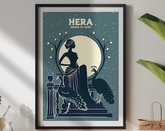 May include: Framed art print featuring a silhouette of Hera, the Queen of Gods, seated with a peacock. The artwork is in shades of blue and white, with the text "HERA QUEEN OF GODS" at the top. The print is displayed on a wooden cabinet.