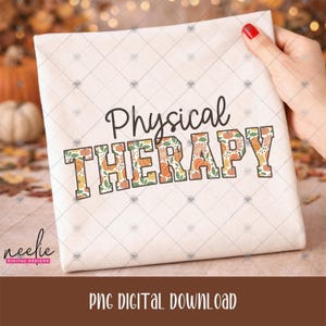 May include: A white fabric square featuring the black text Physical THERAPY. The word Physical is in a script font, while THERAPY is in a block font filled with a pattern of orange pumpkins, green leaves, and small flowers on a white background.