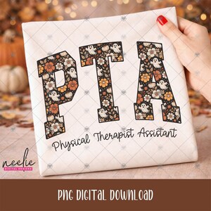 May include: A white fabric surface featuring the large block letters PTA filled with a pattern of orange and white flowers, leaves, and small white ghosts on a black background. Below the letters, the text Physical Therapist Assistant is printed.