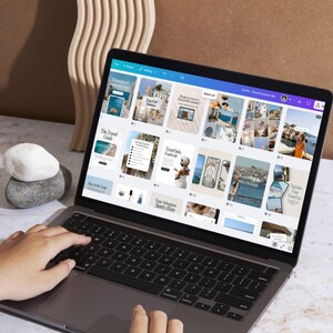 Someone Editing on Canva. Hands editing aesthetic travel Instagram templates in Canva – beginner-friendly, customizable, and perfect for minimal neutral content planning.