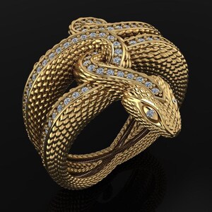 May include: A gold snake ring featuring a detailed scale pattern and small gemstones. The snake is coiled, with its head incorporated into the ring's design. The ring is set against a dark background.