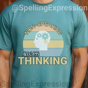 May include: A teal blue t-shirt with a graphic design of a brain with gears inside. The text on the shirt reads "Non-Speaking Always Thinking".