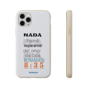 May include: A white iPhone case with a beige border. The case features the text "NADA Podrá separarme del amor de Dios ROMANOS 8:35" in black, blue, and orange. The brand name "VIARA'S" is at the bottom.
