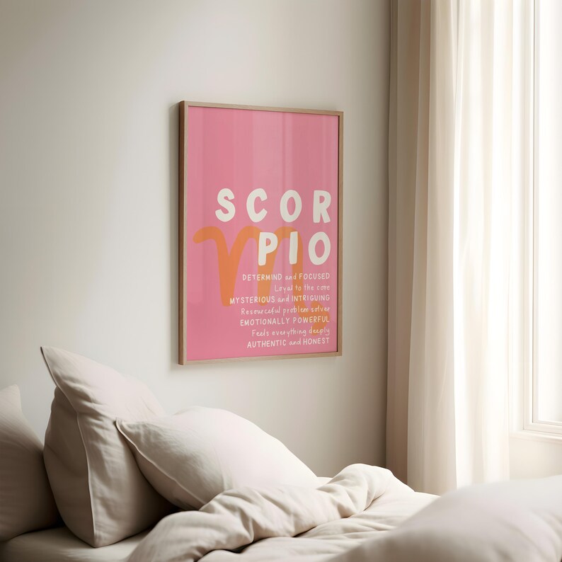 May include: A pink and orange poster with the zodiac sign Scorpio. The poster says "SCORPIO" in large orange letters and lists personality traits for the sign, including "determined and focused", "loyal to the core", "mysterious and intriguing", "resourceful problem solver", "emotionally powerful", "feels everything deeply", "authentic and honest".