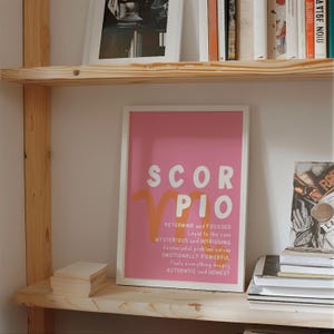 May include: A pink and orange printable poster with the zodiac sign Scorpio and a description of Scorpio personality traits. The text reads "SCOR PIO DETERMINED and FOCUSED Loyal to the core MYSTERIOUS INTRIGUING Resourceful problem solver EMOTIONALLY POWERFUL Feels everything deeply AUTHENTIC and HONEST"