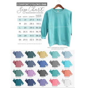 May include: A teal Comfort Colors adult crewneck sweatshirt on a hanger, with a size chart showing measurements in inches. The chart lists sizes S to 3X, with width, length, and sleeve length measurements. Below are examples of sweatshirt colors.