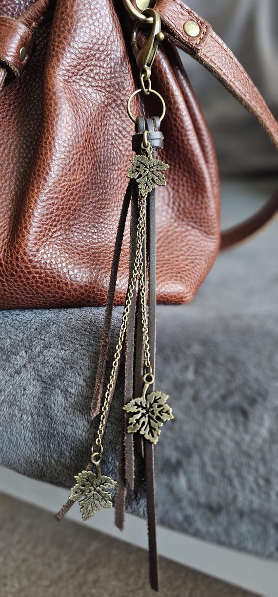 Natural brown leather keychain/ bag charm with brass colored leaf and chain detailing