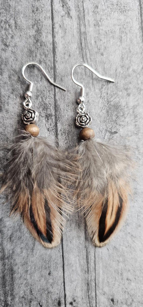 Feather earrings with wooden bead and metal flower beading
