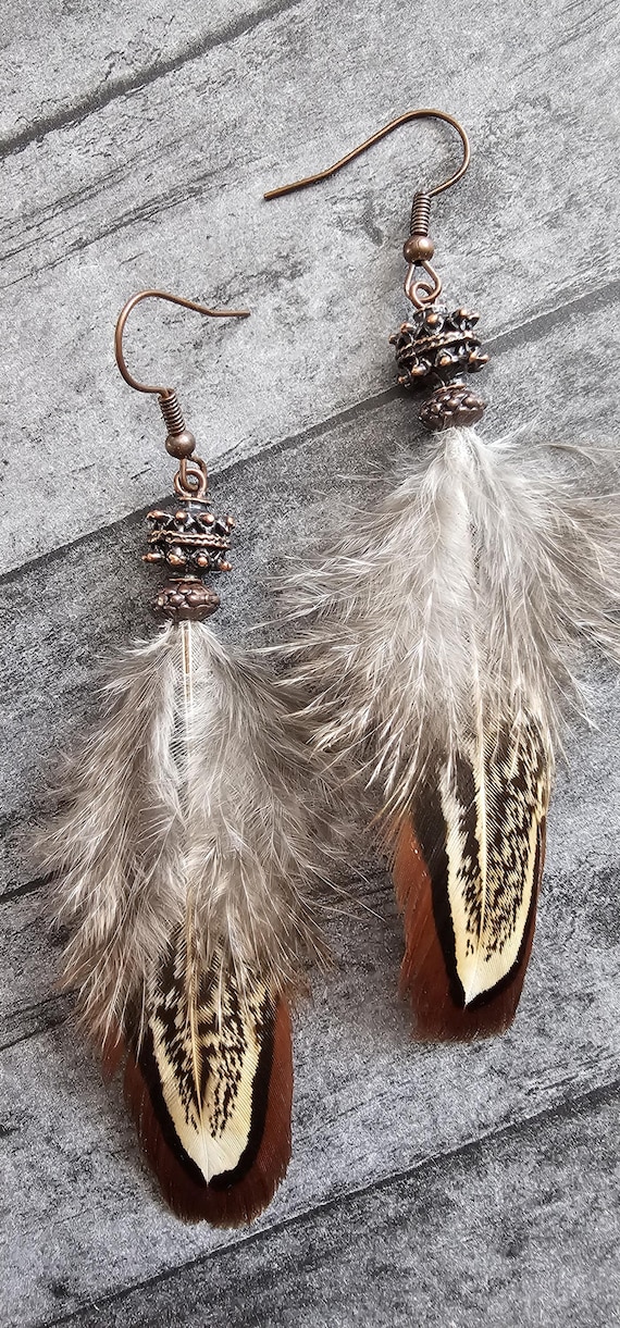 Pheasant feather earrings complimented with  metal beading