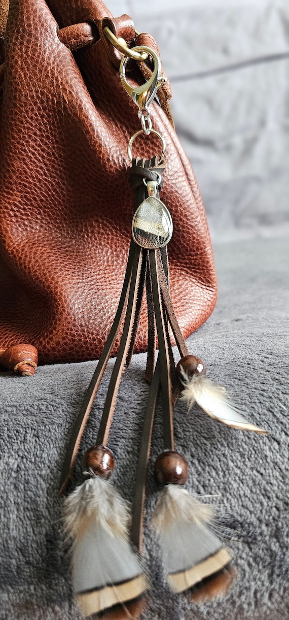 Natural bird feather keychain with resin set cabochon combined with genuine leather and wood beading