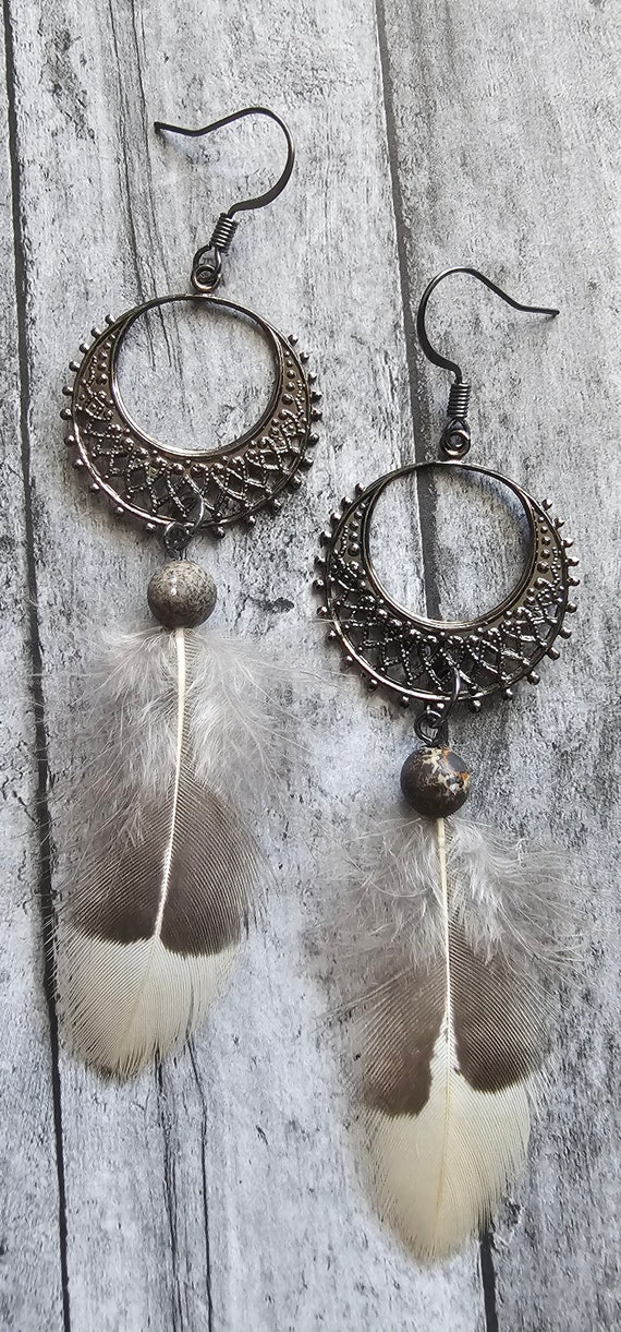 White and gray colored earrings with metal detail