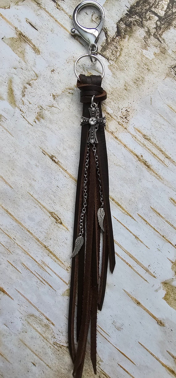 Brown leather keychain with cross and angel wings charms