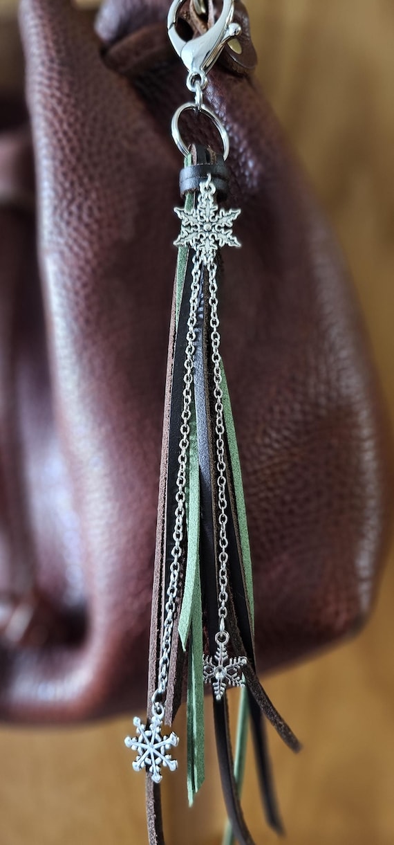 Brown and green leather keychain/bag charm with silver snowflakes