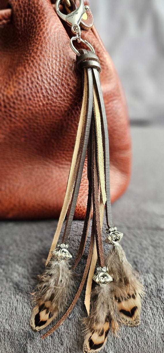 Mixed dark brown leather and beige suede keychain with silver beading and natural feathers