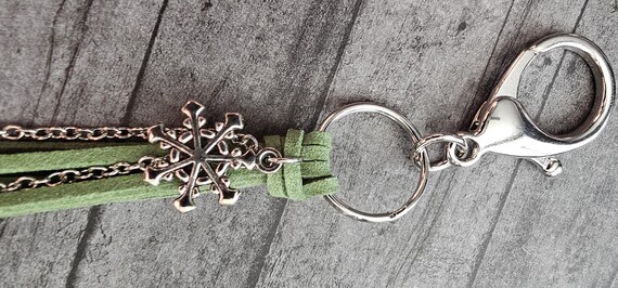 Green tassel style keychain/ bag charm with silver snowflake charms