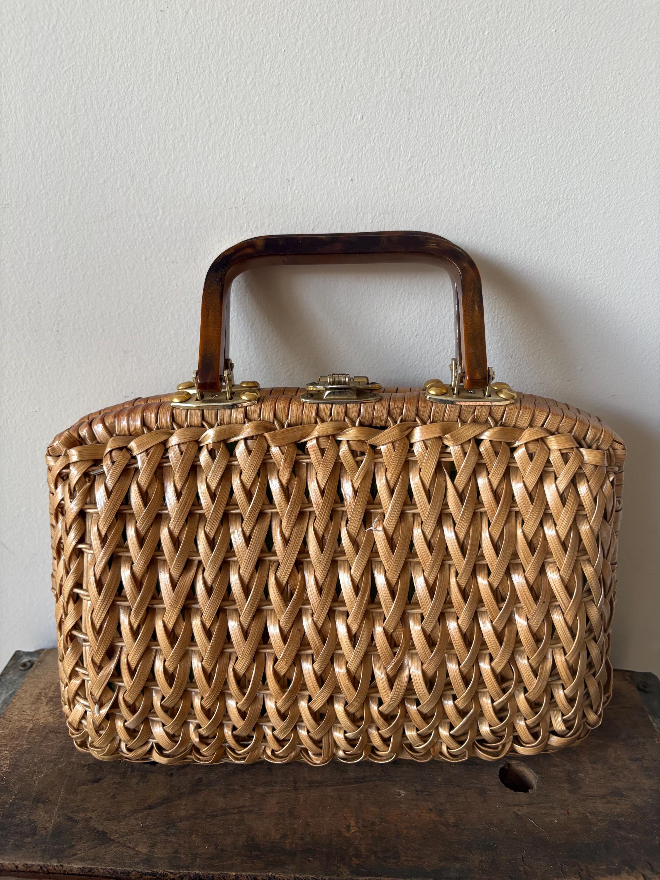 Vintage wicker purse from the 1960s with lucite or Bakelite handles and green interior lining midcentury modern fashion made in Hong Kong