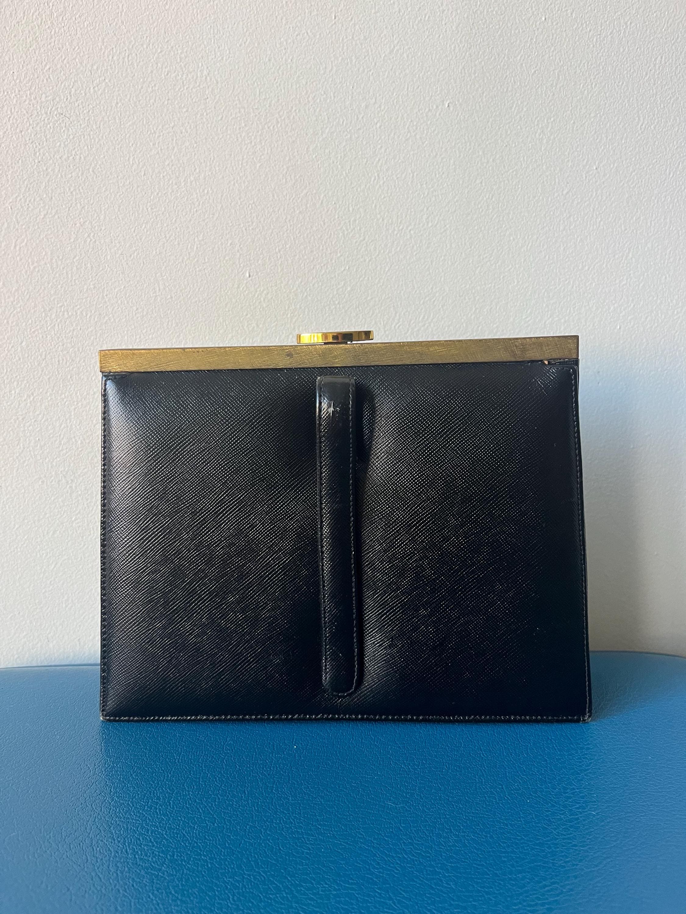 Vintage Mondaine Black Clutch purse with peach silk lining and gold hardware 1950s great condition snap closure MCM