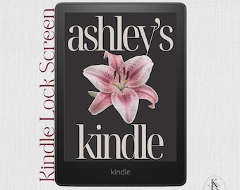 May include: A black e-reader device displaying a lock screen with the text ashley's kindle in a serif font, centred above and below a large, detailed pink lily flower with dark speckles on a dark grey background. The screen also shows EPUB File.