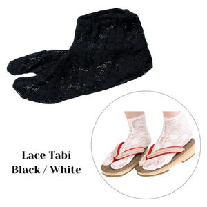 May include: Black lace tabi socks with a split toe, and a pair of white lace tabi socks with geta sandals. The geta sandals have a wooden base with red and beige straps. The text reads "Lace Tabi Black / White."