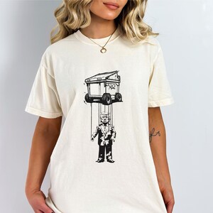 Camiseta anti Trump, camiseta anti-MEGA de Elon, Trump es un vendedor de autos, oficina blanca en venta, camiseta de grafiti político, regalo para liberales