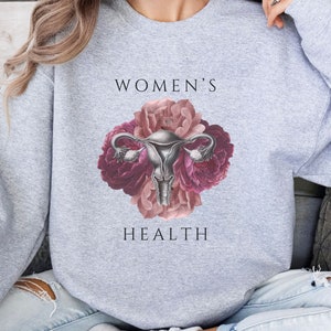 Women&#39;s Health floral uterus OBGYN sweatshirt, female health flower sweater,  gynecology sweatshirt, obstetric nurse, midwife and doula gift