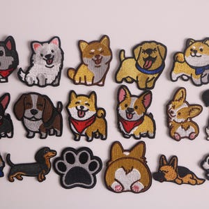 Puede incluir: Colección de parches bordados de perros, incluyendo razas como husky, corgi y dachshund. Los parches presentan detalles de bordado y colores vibrantes, ideales para personalizar ropa o accesorios. Cada parche mide aproximadamente 5 cm de alto.