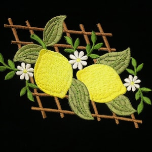 May include: Embroidered design featuring two yellow lemons with green leaves and white flowers on a brown trellis.