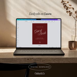 May include: A laptop screen displaying a digital guest book template on the Canva interface. The template features a deep red background with white text that reads Please Sign Our Guest Book, Thank You For Celebrating With Us, and the initials EJ.