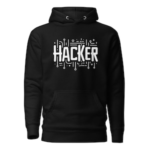 May include: Black hoodie with a white graphic of the word "HACKER" surrounded by circuit board-like lines.
