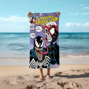 May include: A beach towel featuring a comic book cover of Amazing Spider-Man with Venom. The cover shows Spider-Man's skull with a red and black suit and Venom's face with a black and white suit. The text on the cover reads "Amazing Spider-Man" and "Alas, poor Spider-Man!" and "--I killed him, well!"